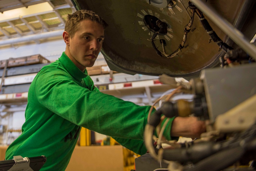 AM3 Conducts Inspection on MH-60S Sea Hawk