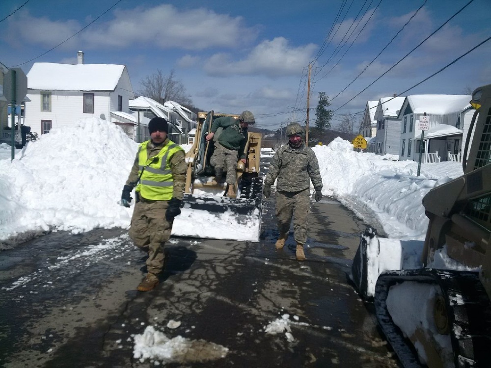 NY Army National Guard Engineers clear snow in Deposit, N.Y.