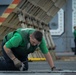 Sailors works on catapult