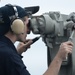 Sailors looks through scope