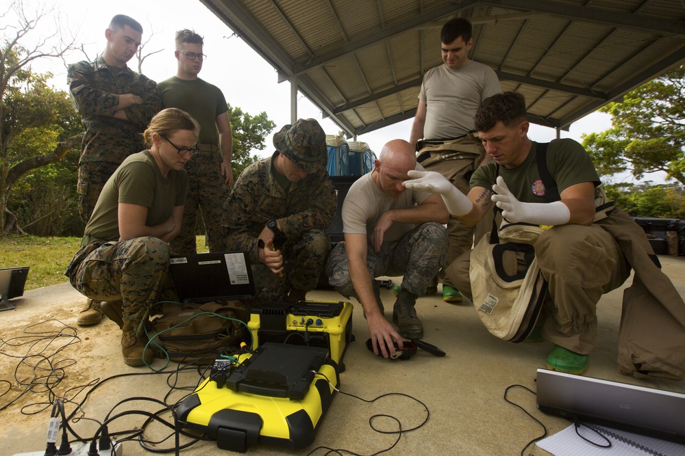 Marines, Airmen participate in chemical, biological, radiological, nuclear threat assessment training