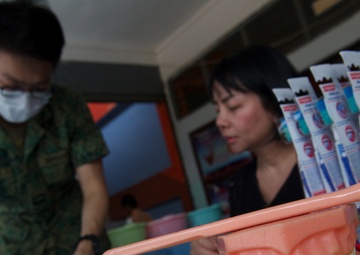 Cope Tiger participants give back to local school, community