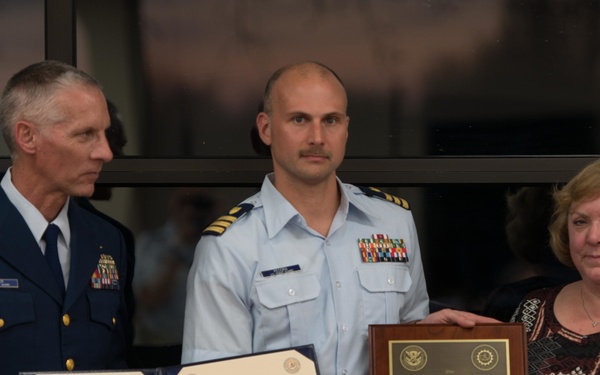 Cmdr. Andrew Pecora accepts the 2016 Capt. Richard D. Poore Award