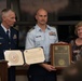 Cmdr. Andrew Pecora accepts the 2016 Capt. Richard D. Poore Award