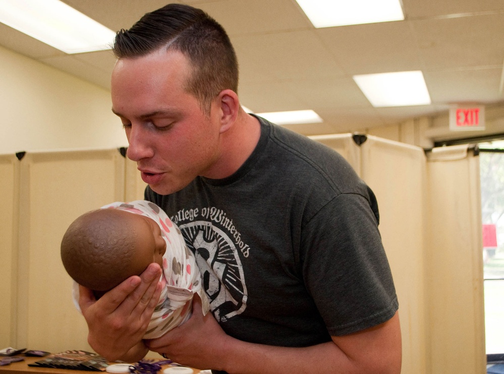 DVIDS Images Dads (& moms) learn how to swaddle, and more