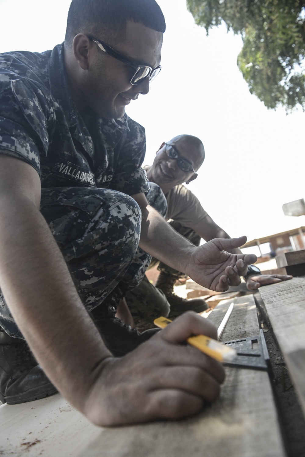 Hospital Corpsman 2nd Class Emilio Valladares Measures Wood to Help Build a Table for the Continuing Promise 2017 (CP-17) Medical Site in Mayapo, Colombia