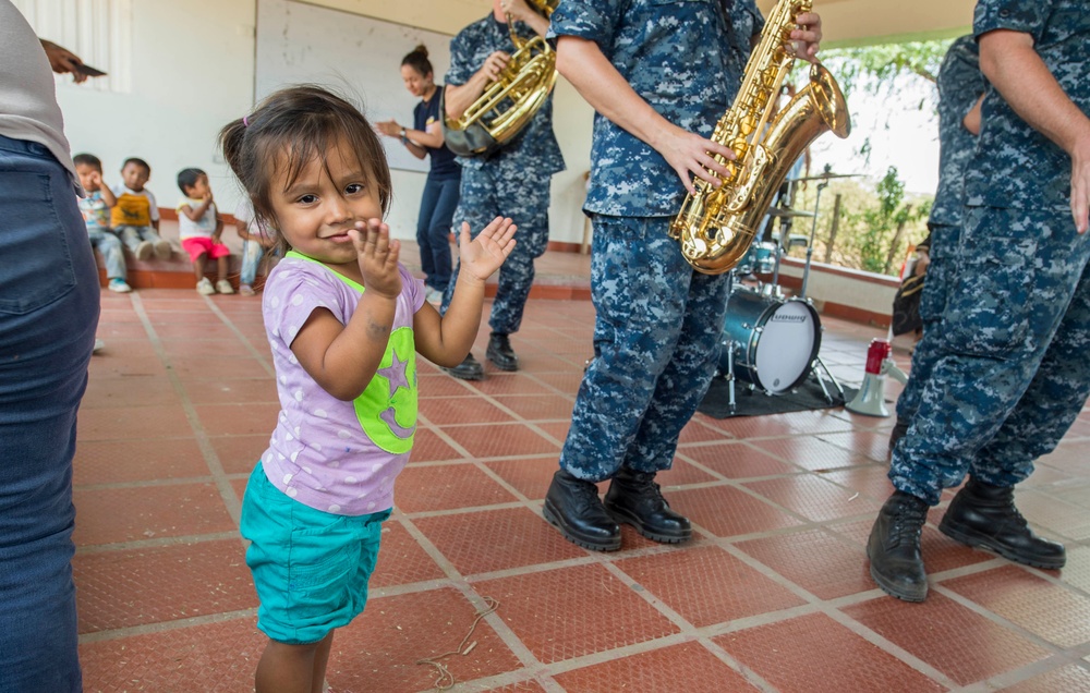 A Colombian Child Claps as Members of the U.S. Fleet Forces (USFF) Band, Norfolk, Va., Perform in Support of Continuing Promise 2017’s (CP-17) Visit to Mayapo, Colombia