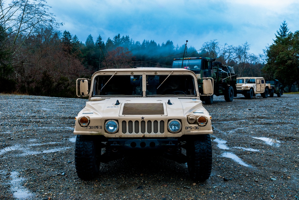 Soldiers from the 301st Maneuver Enhancement Brigade prepare to depart for a convoy