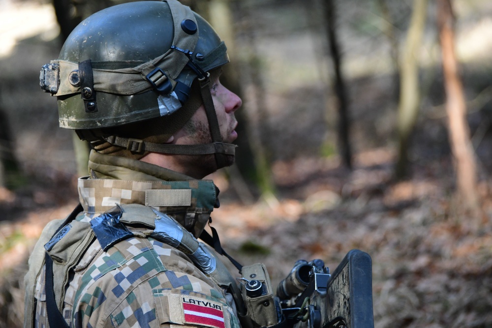 Latvian Soldier Listening to Instruction