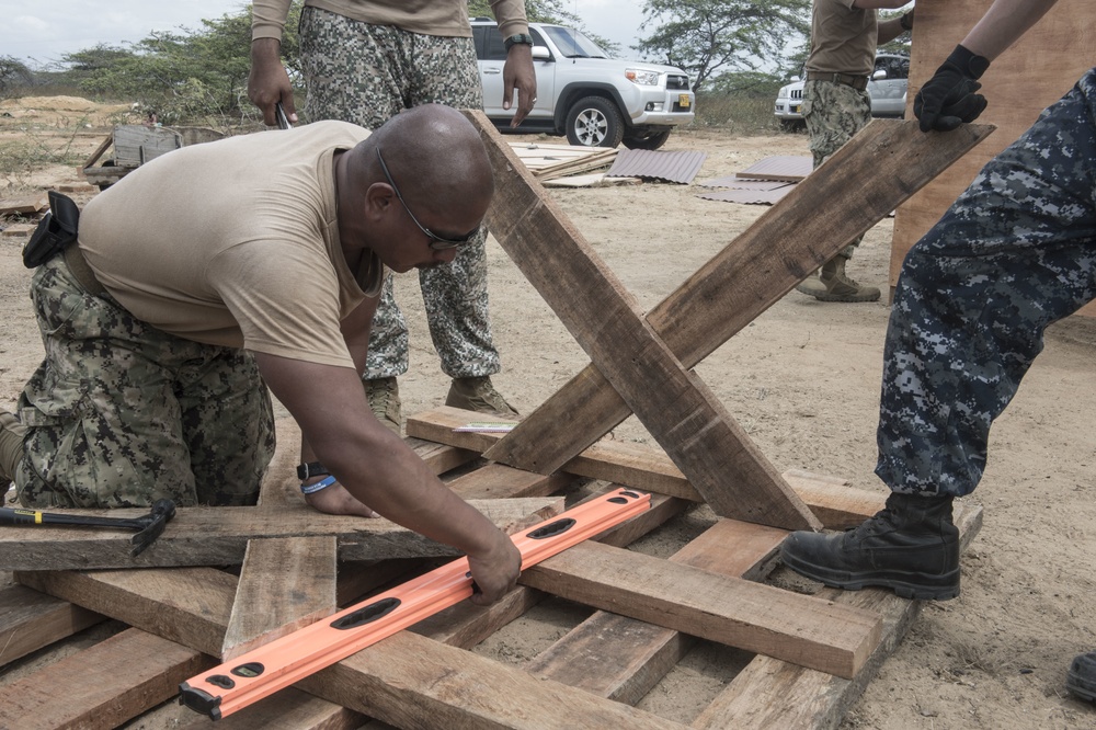 Construction Electrician 2nd Class JanRainier San Juan Builds a Table for a Wayuu Tribe in Mayapo, Colombia, During Continuing Promise 2017 (CP-17)