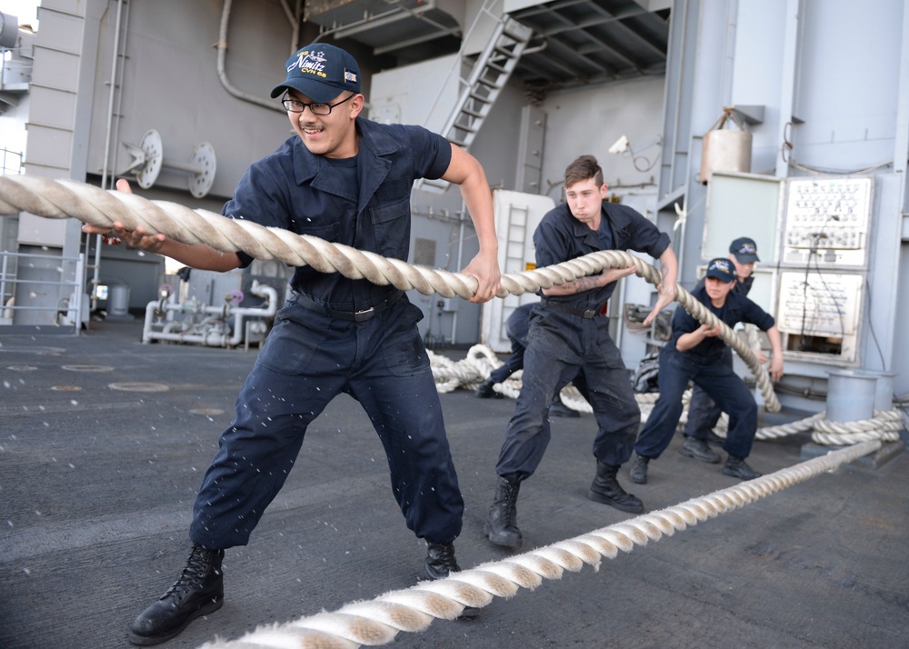 Sailors handle lines