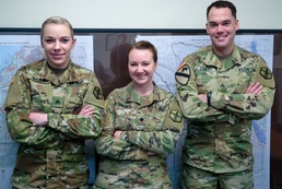 Geospatial engineers pose for a photograph at the 301st Maneuver Enhancement Brigade headquarters