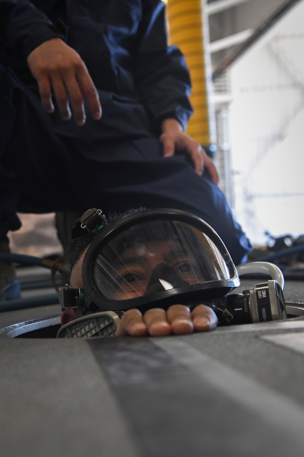 Airmen and Firefighters partner for training during confined space rescue exercise.