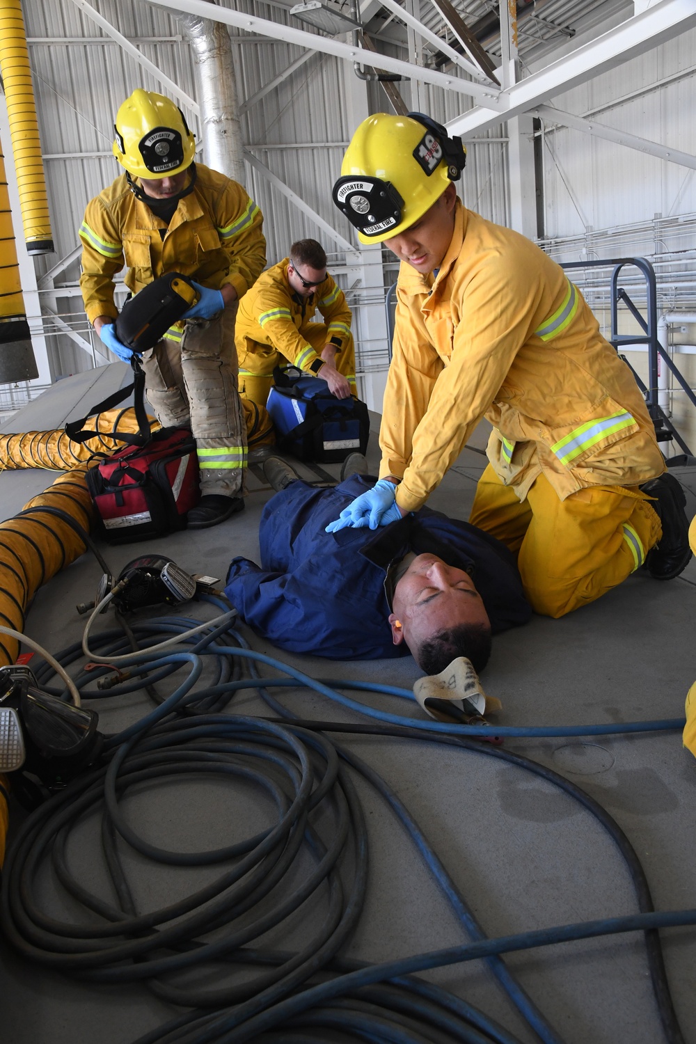 Airmen and Firefighters partner for training during confined space rescue exercise.