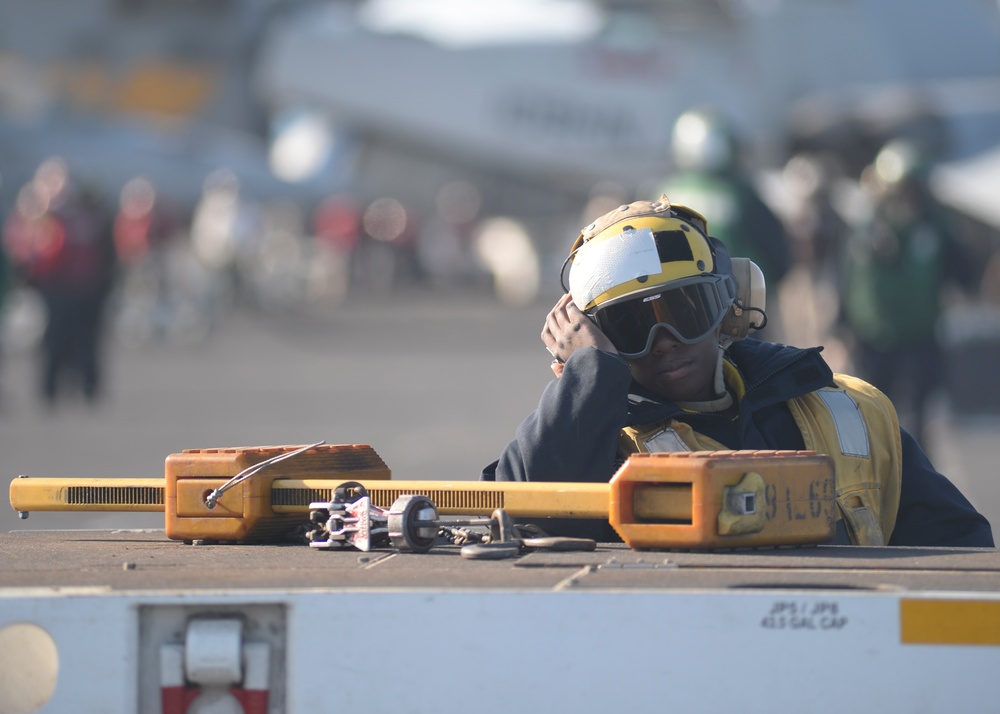 Sailor rests on tractor