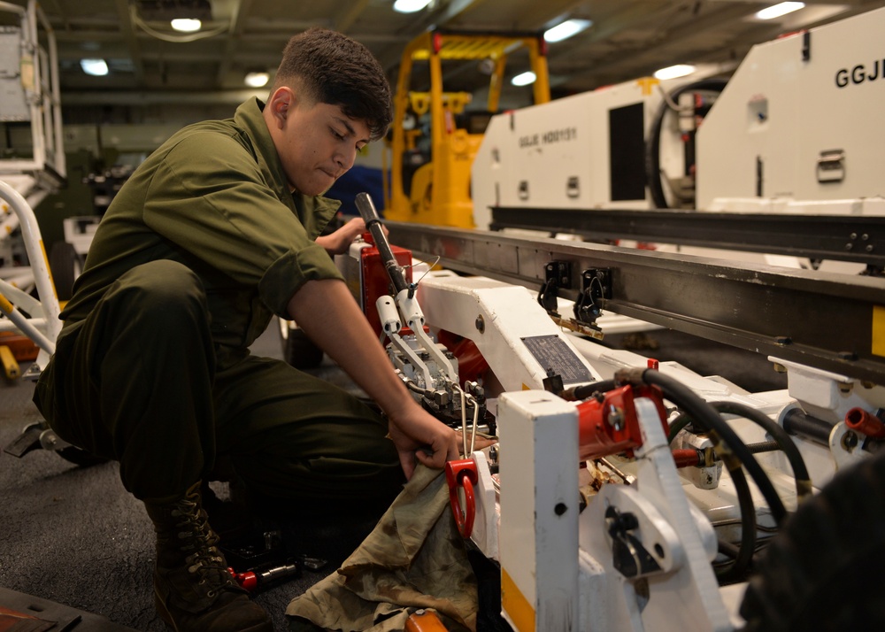 Sailor Conducts Maintenance