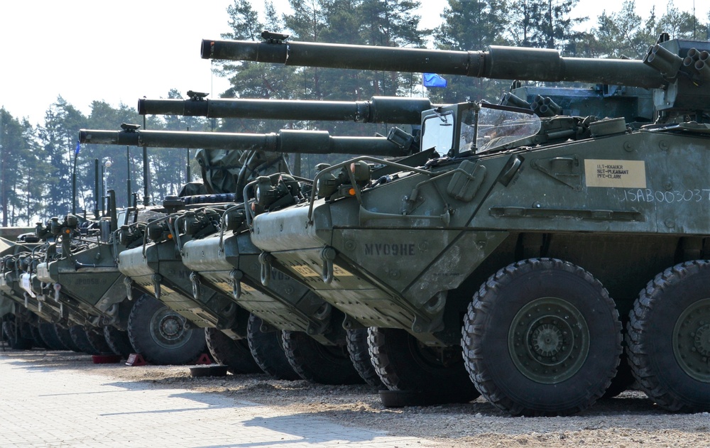 Stryker armored vehicles sit in the motor pool