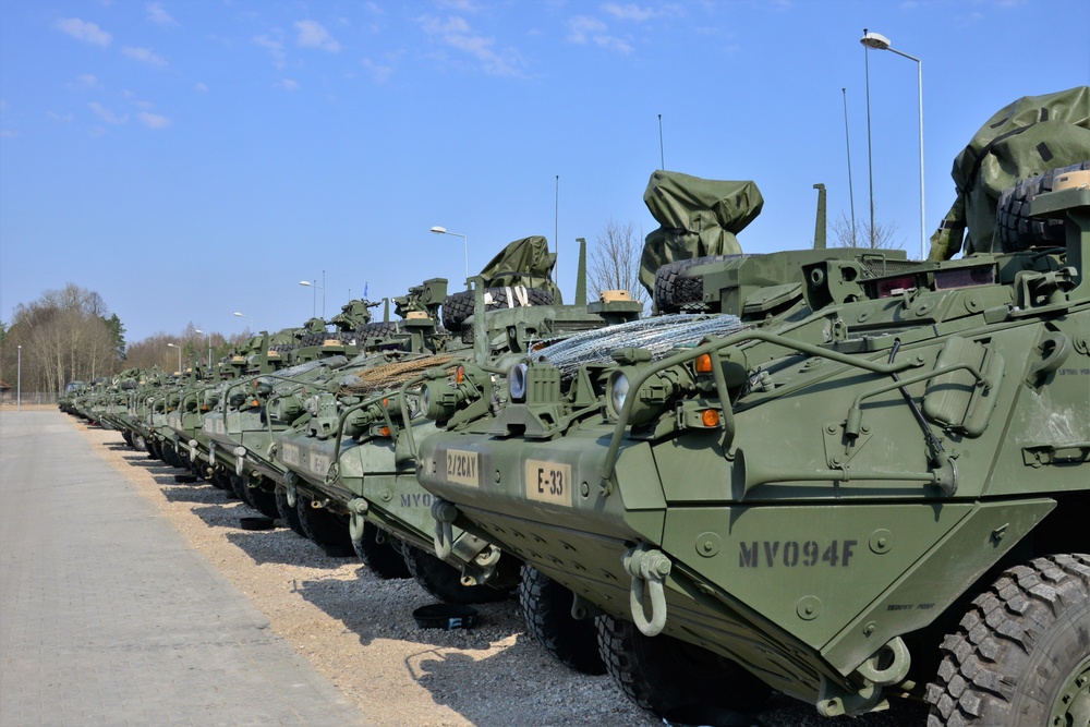 Stryker armored vehicles sit in the motor pool