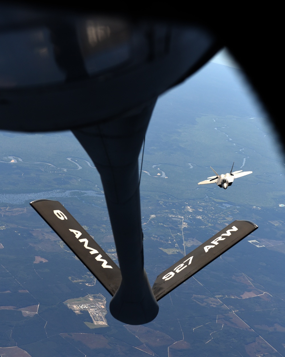 KC-135 Stratotanker flight with F-22 Raptor