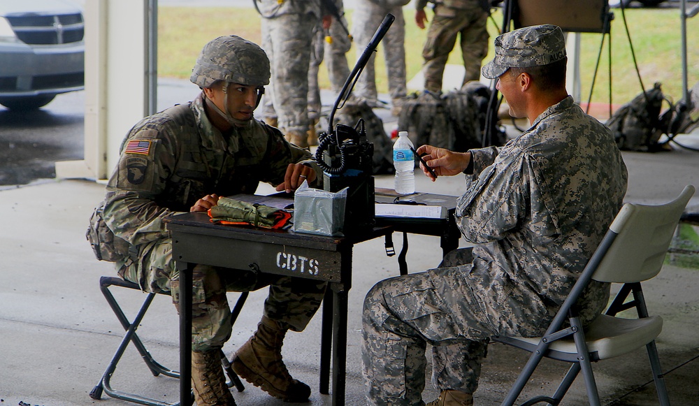 National Guard Soldier finishing a nine-line MEDEVAC during the Expert Infantry Badge qualification