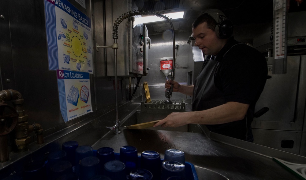 Interior Communications Electrician 3rd Class Brandon Burhop Cleans Dishes