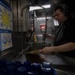 Interior Communications Electrician 3rd Class Brandon Burhop Cleans Dishes