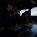 Quartermaster Seaman Douglas Mahan and Quartermaster 2nd Class Brittney Hines Record the Ship’s Position