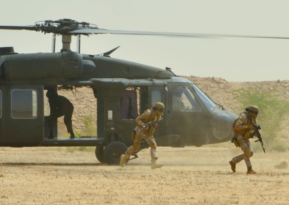 Elite special forces teams from GCC and U.S. simulate a joint raid on a hostile objective