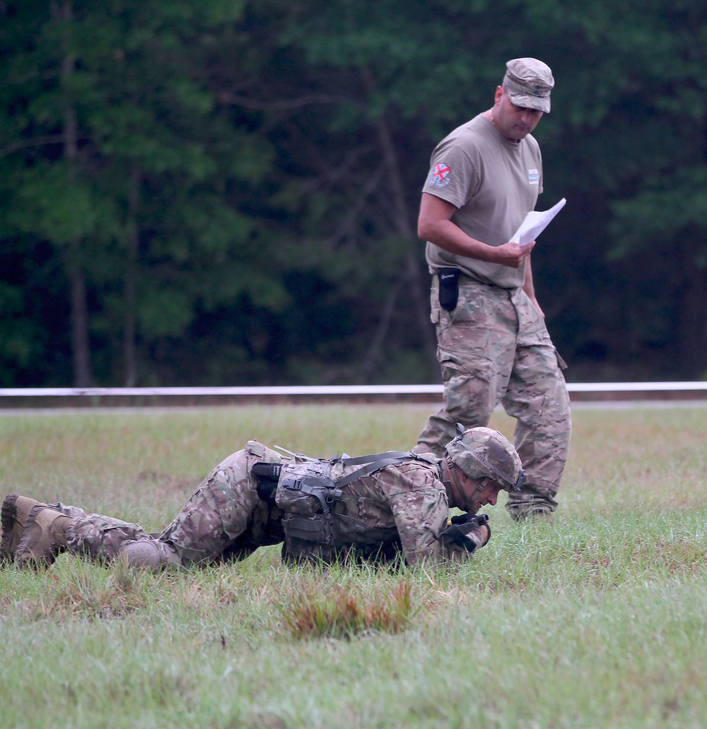 National Guard Solider low crawls during the Expert Infantry Badge qualification