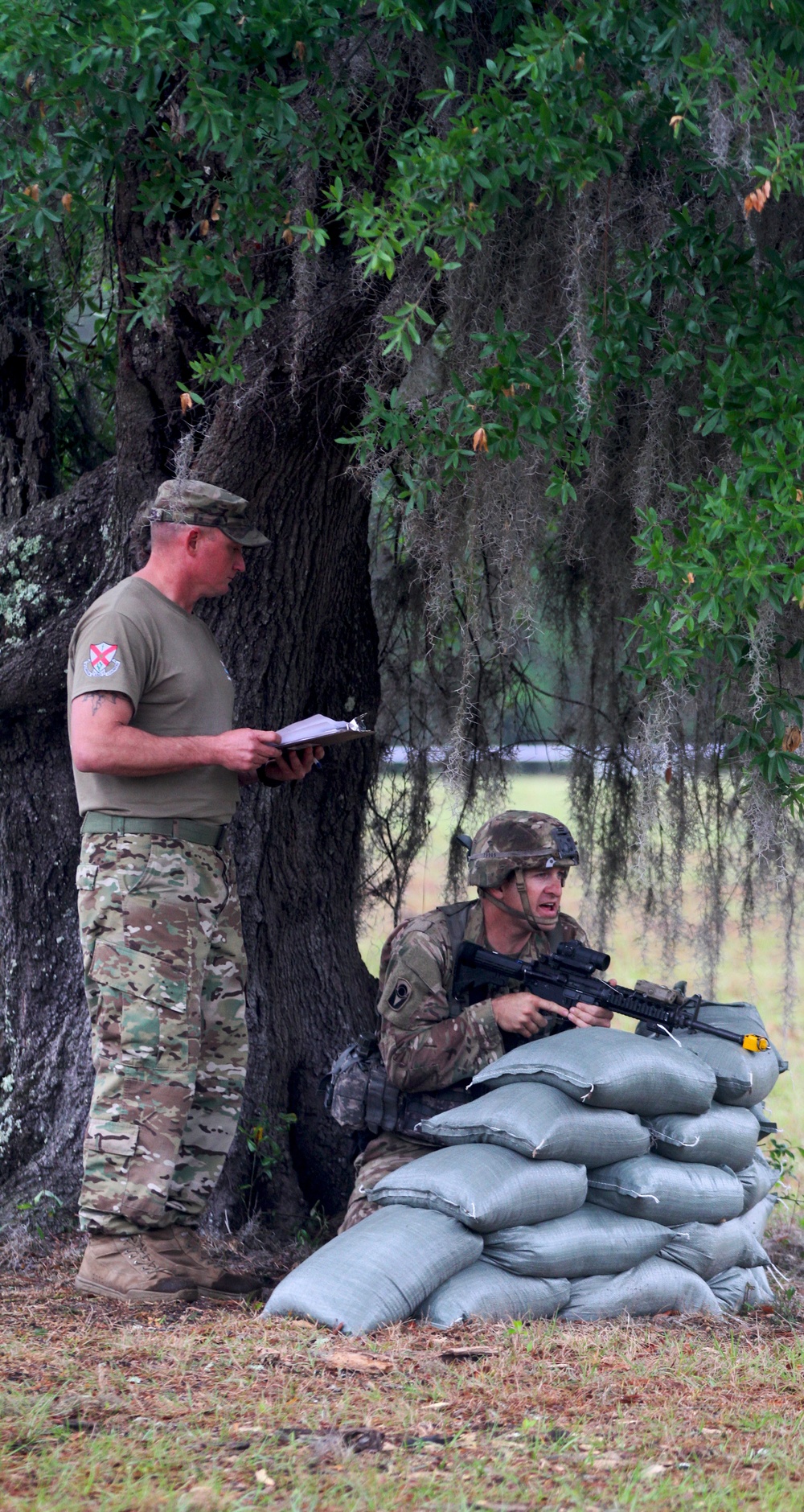 National Guard Solider protects his area during Expert Infantry Badge qualification
