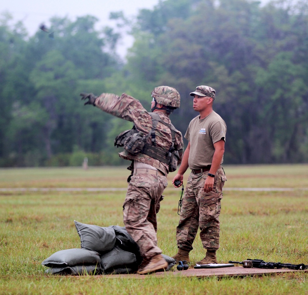 National Guard Solider throws grenade during the Expert Infantry Badge qualification