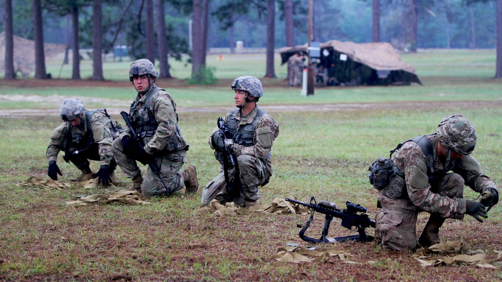 National Guard soldiers prepare for their next assessment during the Expert Infantry Badge qualification