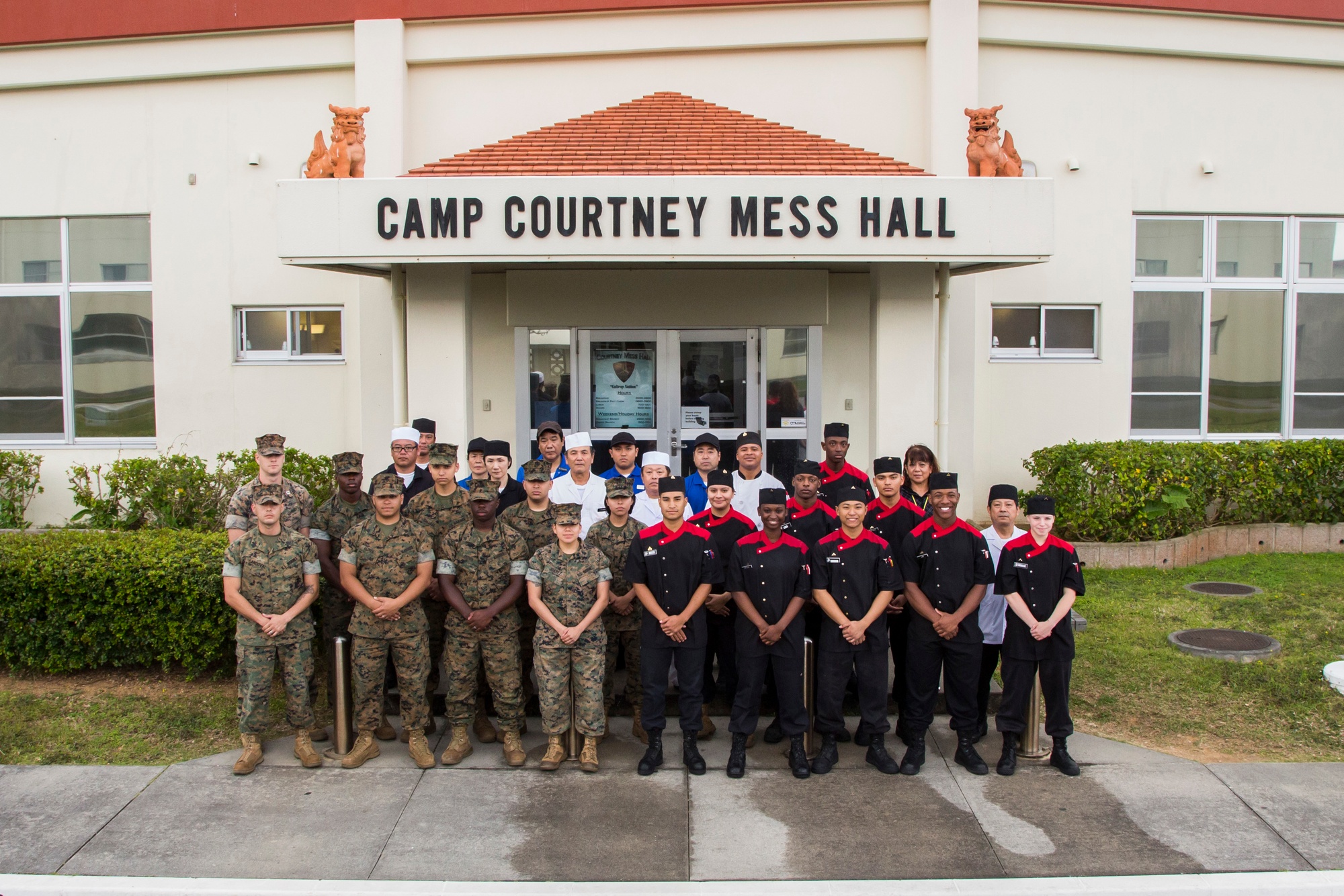 CAMP COURTNEY, OKINAWA, Japan – Students from the local community talk with  Marines during Camp Courtney's Summer English class Aug. 16 at the Camp  Courtney Mess Hall, Okinawa, Japan. This weeklong class