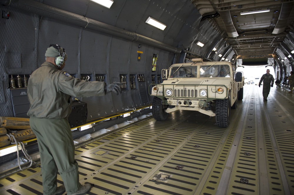 Airman directs Humvee