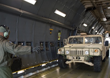 Airman directs Humvee