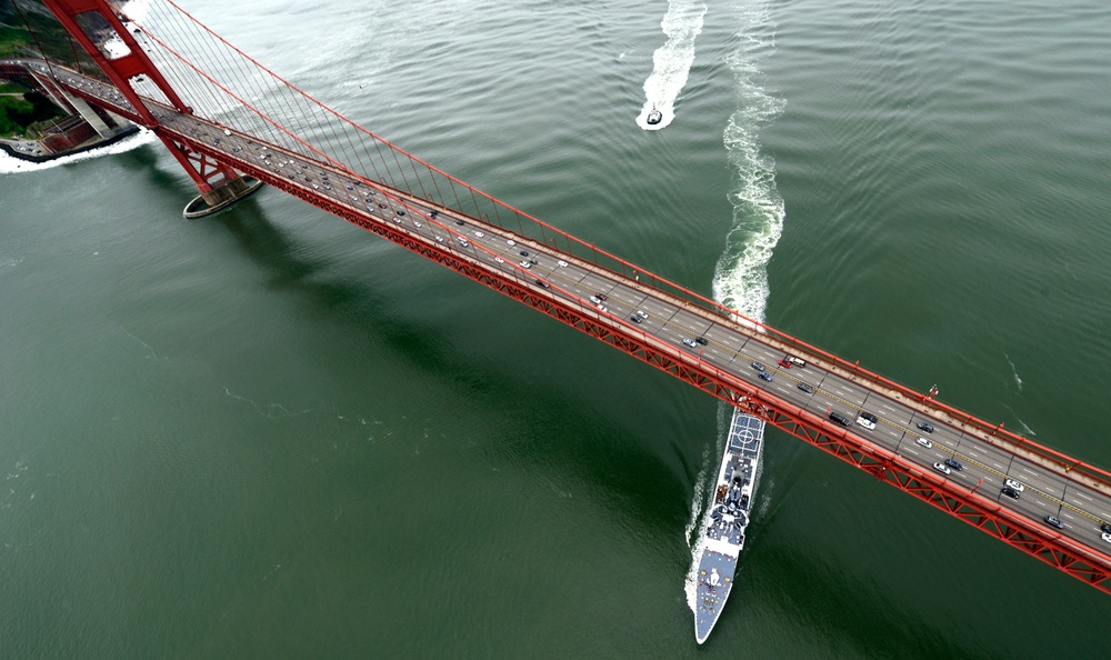 Coast Guard Cutter Munro passes under the Golden Gate Bridge