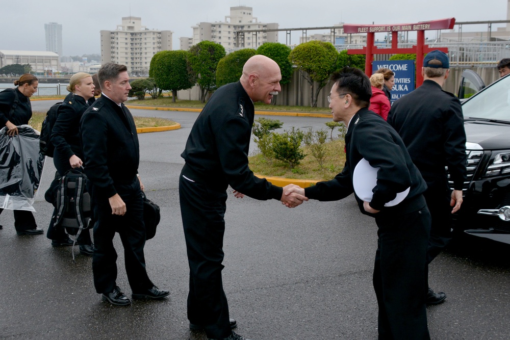 Admiral Scott Swift, commander of the U.S. Pacific Fleet, left greets Capt. Jeffrey Kim, Commander, Fleet Activities Yokosuka (CFAY).