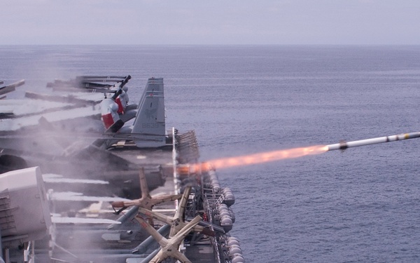 A rolling airframe missile (RAM), a surface-to-air intercept missile, launches from amphibious assault ship USS America (LHA 6)