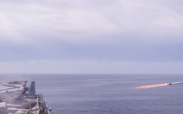A rolling airframe missile (RAM), a surface-to-air intercept missile, launches from amphibious assault ship USS America (LHA 6)