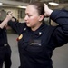 Master-at-Arms 1st Class Michelle Mitchell and Master-at-Arms 2nd Class Joshua Mcconchie perform proper handcuffing techniques during a self defense training exercise
