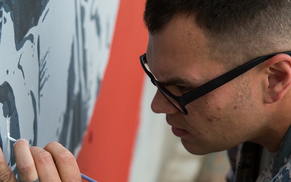 On-duty firefighter, off-duty artist: Deployed Airman improves work environment