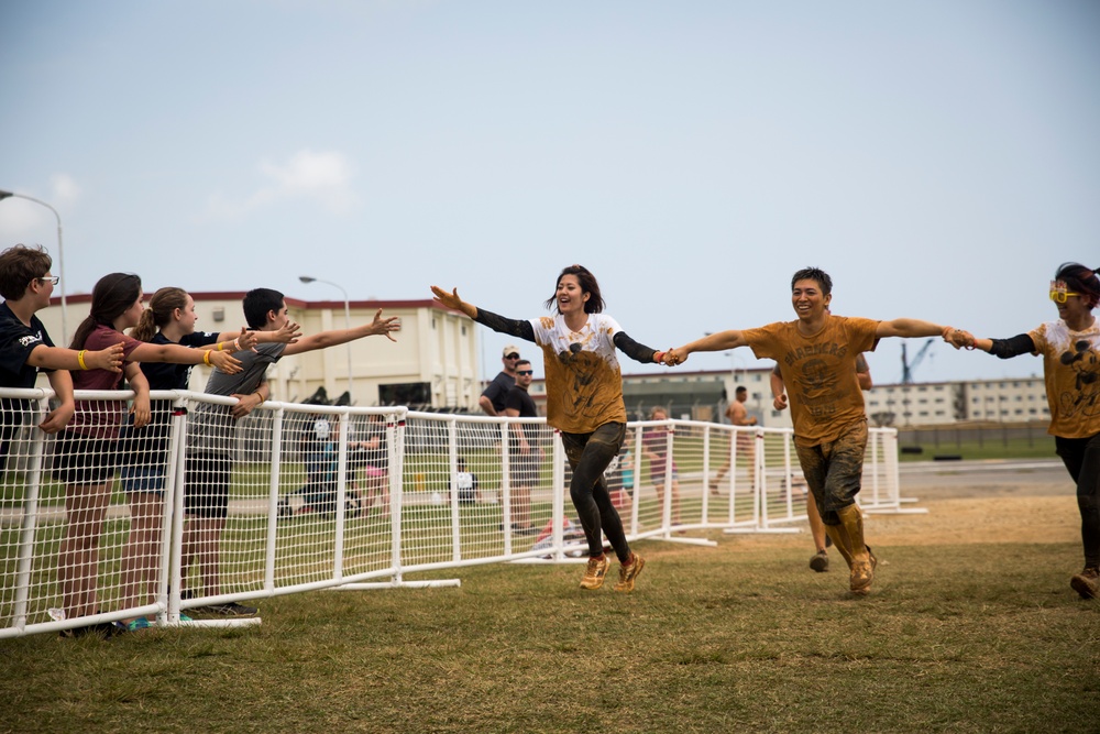 Down and Dirty | Service members, Okinawans gather for Camp Hansen’s annual mud run