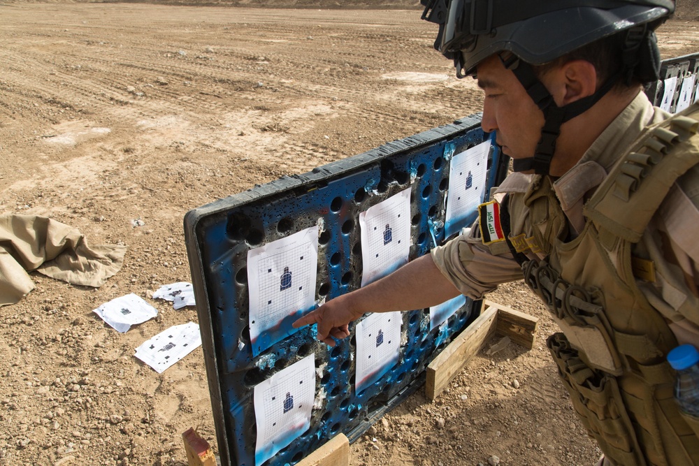 Iraqi security forces group and zero their rifles
