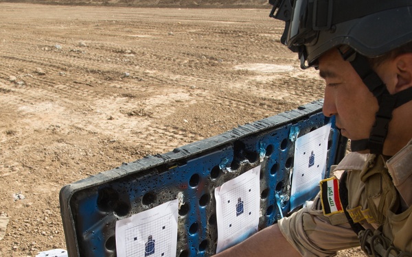 Iraqi security forces group and zero their rifles