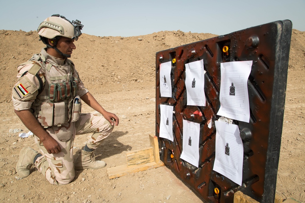 Iraqi security forces group and zero their rifles