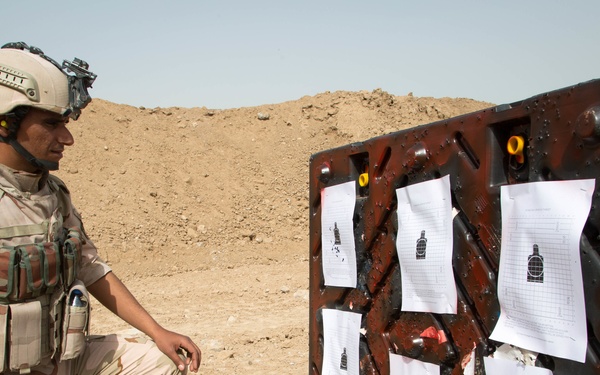 Iraqi security forces group and zero their rifles