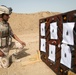 Iraqi security forces group and zero their rifles