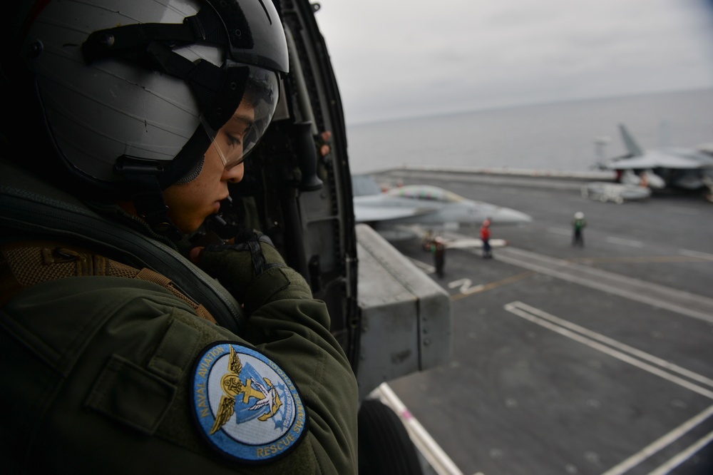 Helo Prepares to Land on Nimitz Flightdeck