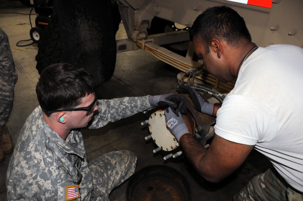 Army Reserve Soldiers perform vehicle maintenance