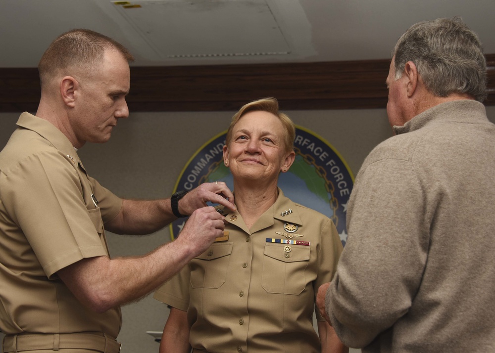 Vice Adm. Nora W. Tyson receives CPO anchors from Navy MCPON Steven Giordano